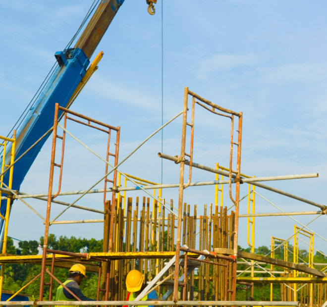 Construction site with crane and workers