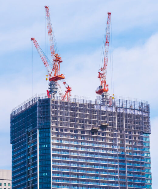 Crane building under construction exterior with sky background